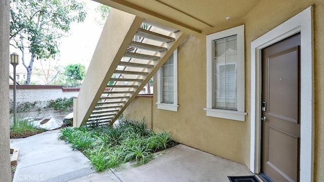 entrance to property with a patio area