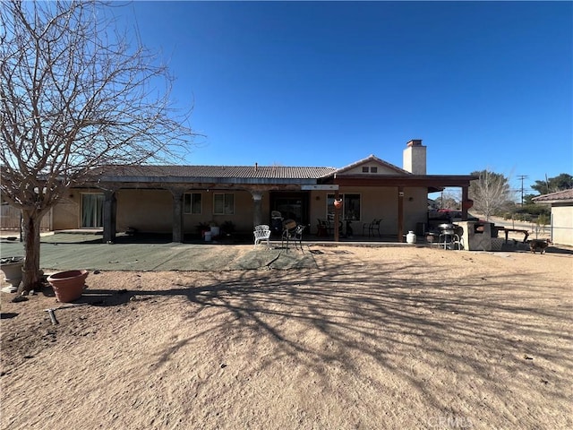 back of property with a patio area