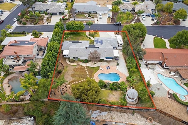 birds eye view of property with a residential view