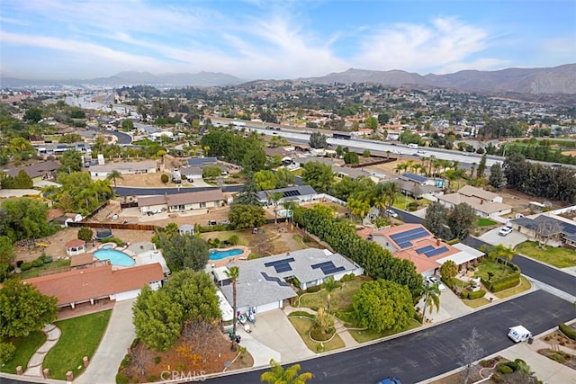 birds eye view of property featuring a mountain view