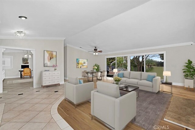 7230 Sarsaparilla Dr, Corona, CA 92881 - living area with ornamental molding, ceiling fan, baseboards, vaulted ceiling, and light tile patterned floors