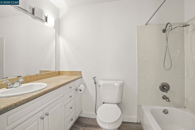 full bathroom with shower / tub combination, vanity, toilet, and hardwood / wood-style floors