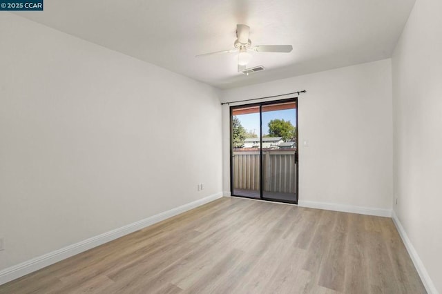 spare room featuring ceiling fan and light wood-type flooring