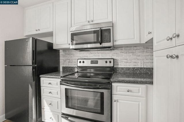 kitchen with white cabinetry, stainless steel appliances, and tasteful backsplash