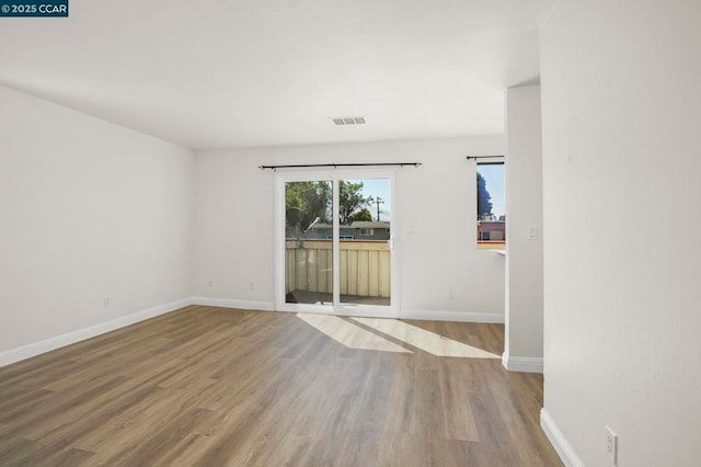 unfurnished room featuring hardwood / wood-style floors