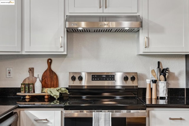 kitchen with stainless steel electric range oven, dishwasher, dark stone countertops, white cabinets, and exhaust hood