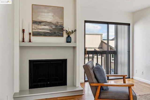 living area featuring hardwood / wood-style floors