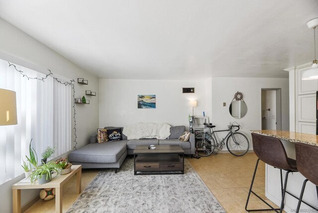 living room featuring light tile patterned floors