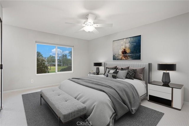 bedroom featuring light colored carpet and ceiling fan