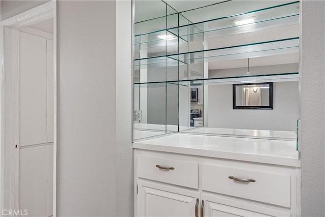 bar featuring white cabinetry