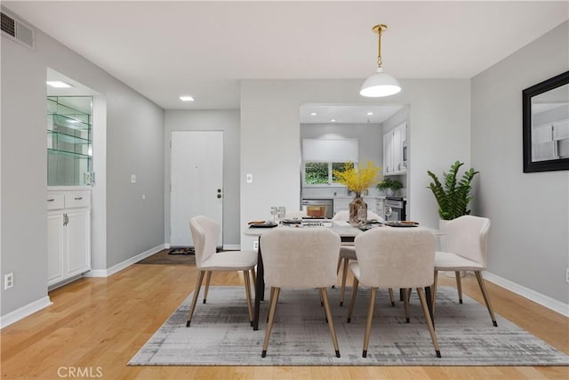 dining room featuring light wood-type flooring