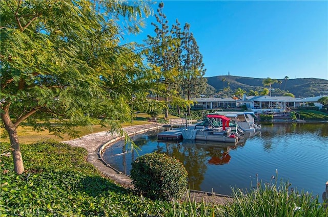 exterior space featuring a water and mountain view