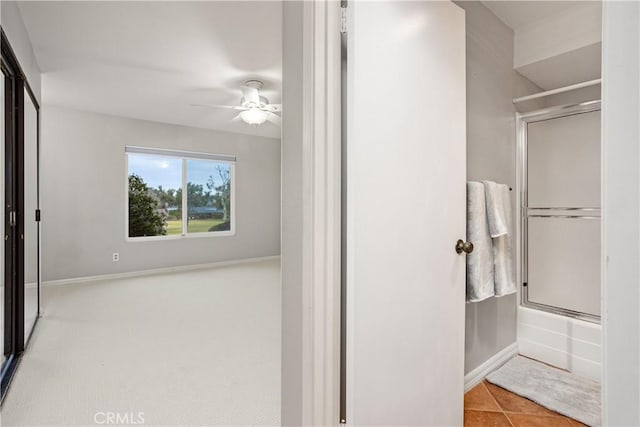 bathroom with ceiling fan, shower / bath combination with glass door, and tile patterned flooring