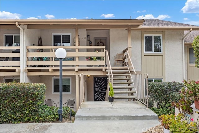 property entrance with a balcony