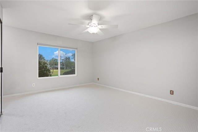 carpeted empty room with ceiling fan