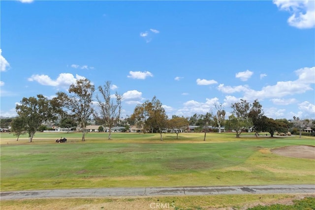 view of property's community with a lawn