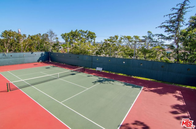 view of sport court featuring basketball hoop