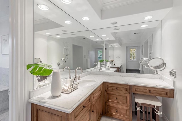 bathroom featuring ornamental molding and vanity