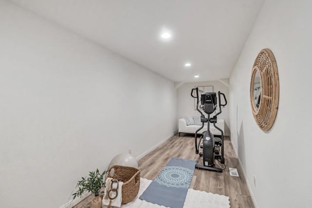 workout area with light wood-type flooring