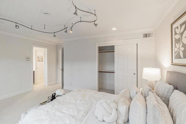 bedroom featuring light colored carpet, ornamental molding, and a closet