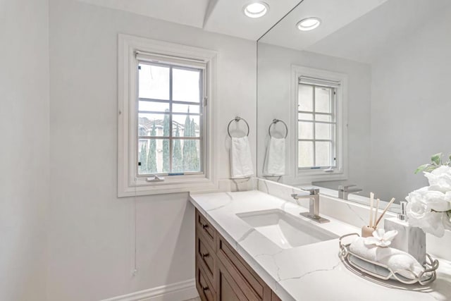 bathroom with vanity and a healthy amount of sunlight