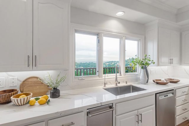 kitchen featuring white cabinetry, dishwasher, light stone countertops, and sink