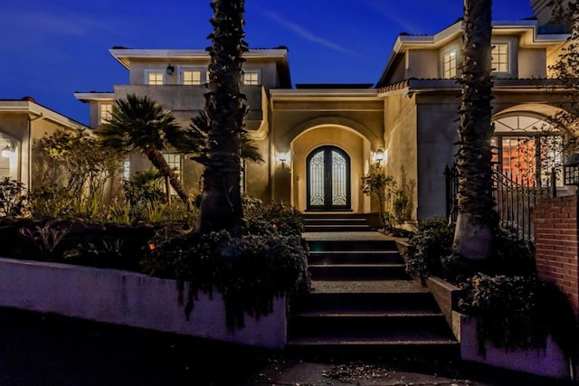 property entrance featuring french doors