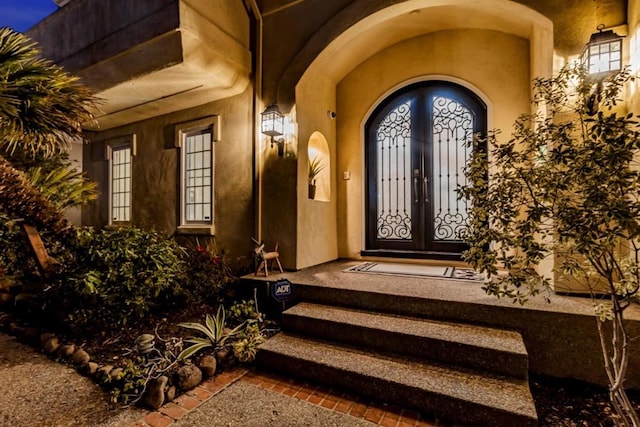 property entrance featuring french doors