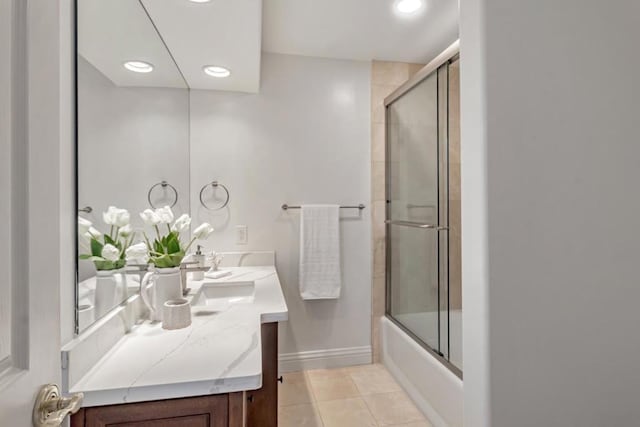 bathroom with vanity, tile patterned flooring, and shower / bath combination with glass door