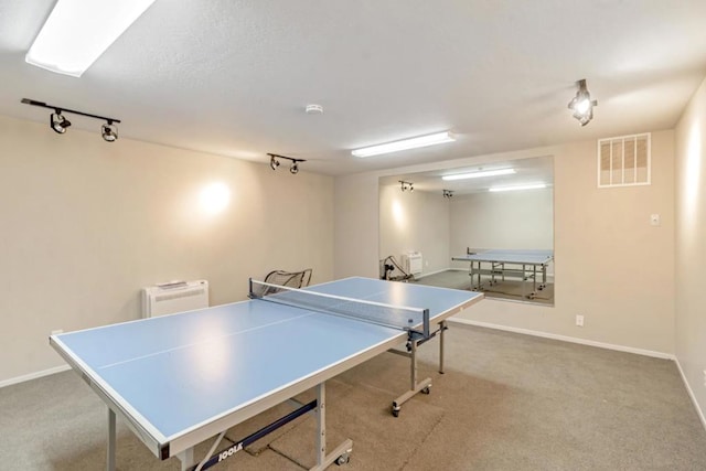 playroom with light carpet and rail lighting