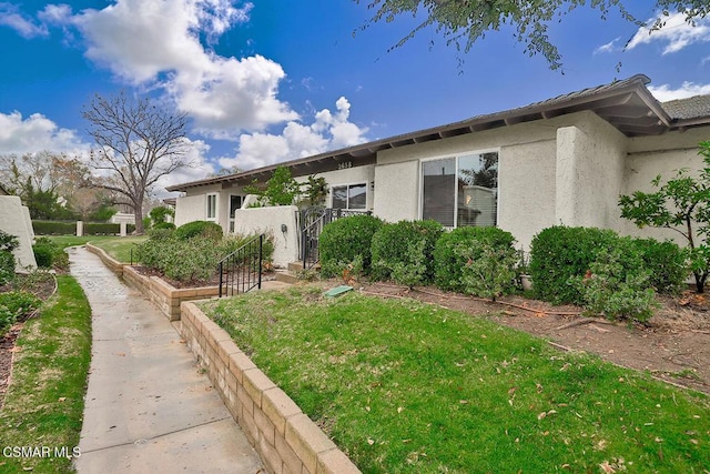 exterior space featuring a front lawn