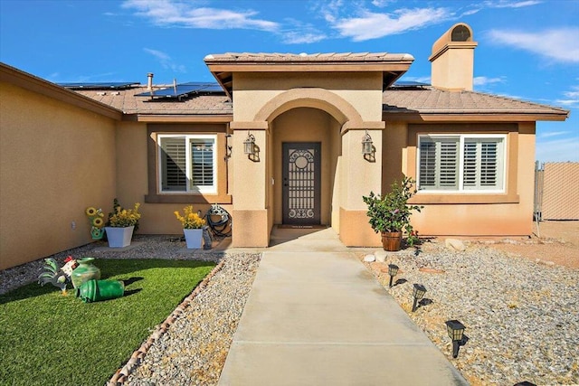 entrance to property featuring solar panels