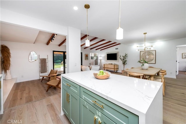 kitchen with light hardwood / wood-style flooring, green cabinets, lofted ceiling with beams, a kitchen island, and decorative light fixtures