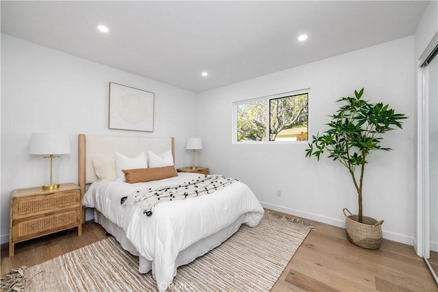 bedroom with light hardwood / wood-style flooring