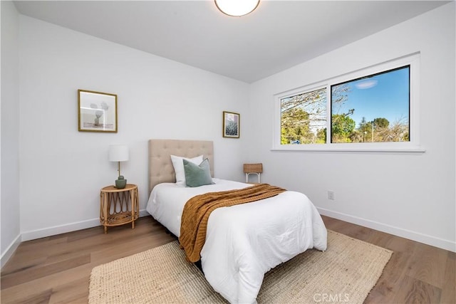 bedroom with wood-type flooring