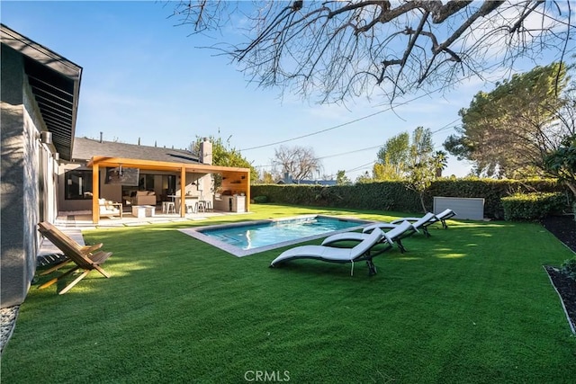 view of pool featuring a patio area and a lawn