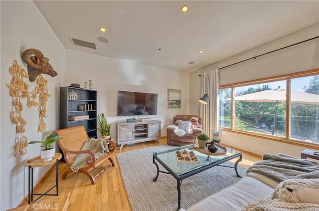 living room with light hardwood / wood-style floors