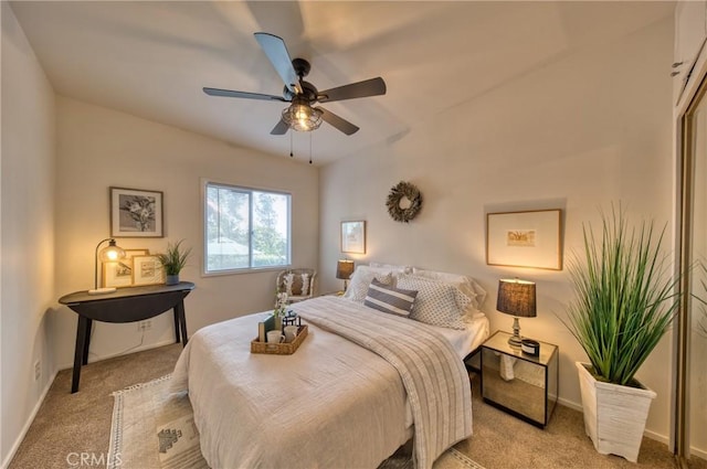 bedroom with light colored carpet and ceiling fan