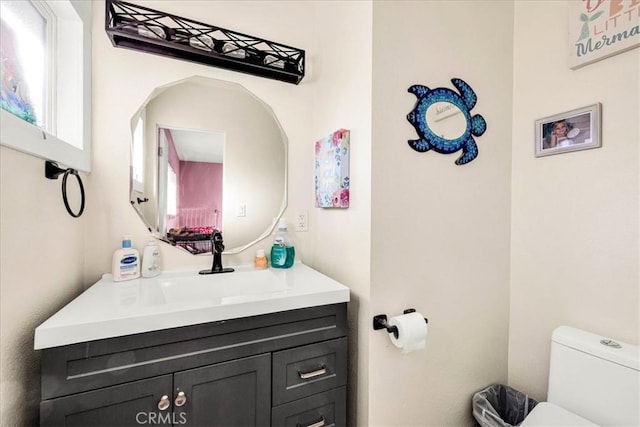 bathroom with vanity and toilet