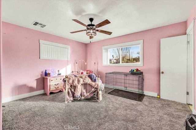 carpeted bedroom with ceiling fan