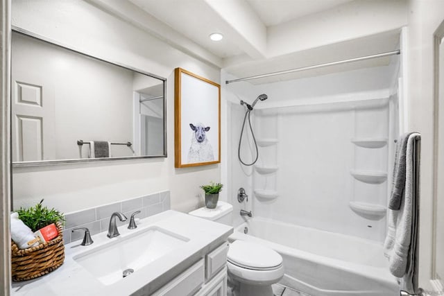 full bathroom with vanity, backsplash, shower / tub combination, and toilet