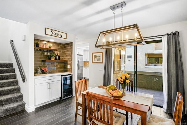 dining space with wine cooler and bar area