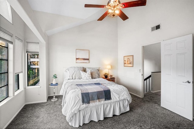 bedroom featuring dark carpet, high vaulted ceiling, and ceiling fan