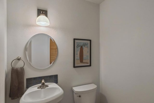 bathroom with toilet and sink