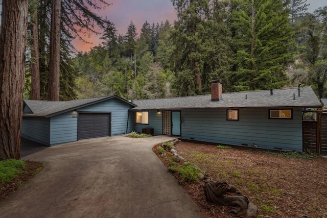 ranch-style house featuring a garage