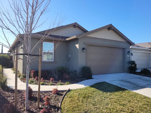 view of front of property with a garage and a front yard