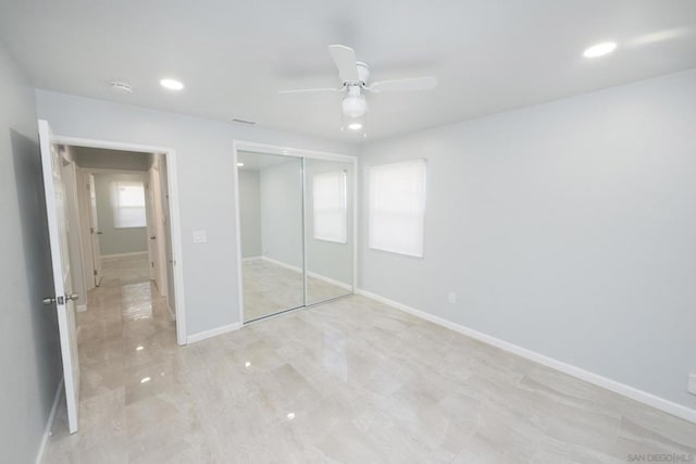 unfurnished bedroom with a closet and ceiling fan