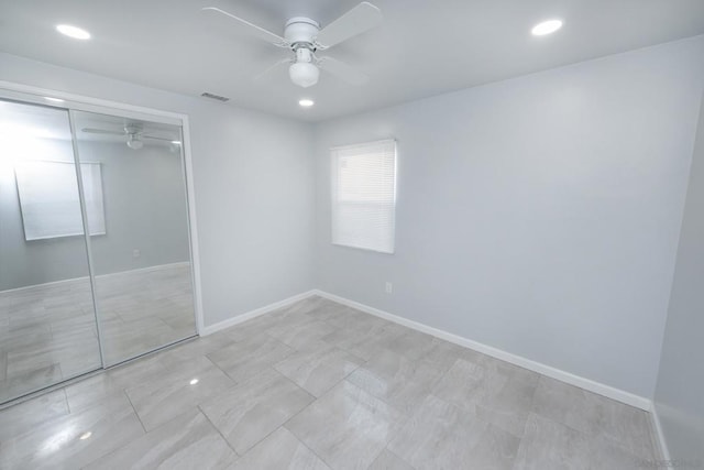 unfurnished bedroom featuring a closet and ceiling fan