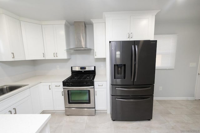 kitchen with white cabinets, sink, wall chimney exhaust hood, and appliances with stainless steel finishes