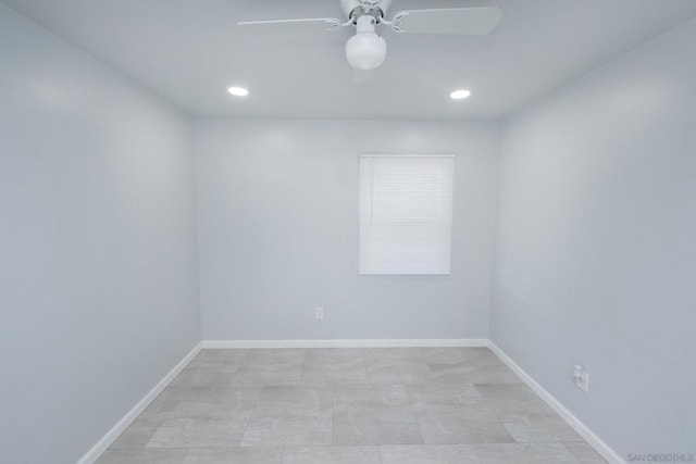 spare room with ceiling fan